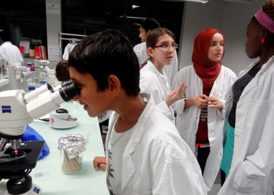 Teenagers in chemistry workshop