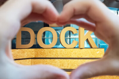 Hands forming a heart around the word DOCK