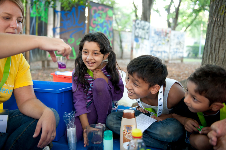 Children doing research in the park